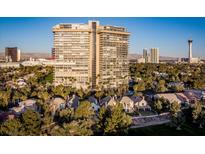 Stunning high-rise residential building with lush landscaping and panoramic city views at 3111 Bel Air Dr # 21A & 21C, Las Vegas, NV 89109