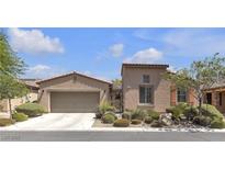 Charming single-story home featuring a two-car garage and desert landscaping at 4408 Oasis Plains Ave, North Las Vegas, NV 89085