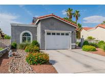 Charming single-story home with a well-maintained yard and attached two-car garage at 6536 Pleasant Plains Way, Las Vegas, NV 89108