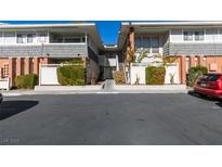Inviting two-story condo with well-maintained landscaping and convenient parking at 668 Oakmont Ave # 1715, Las Vegas, NV 89109