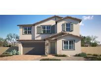 Two-story home featuring a neutral color scheme, shuttered windows, tile roof, and a two car garage at 774 Cloud Creek St, Henderson, NV 89011