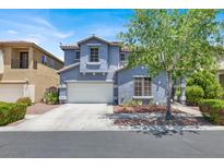Charming two-story home with a well-maintained front yard and attached two-car garage at 9408 Ironsend St, Las Vegas, NV 89143