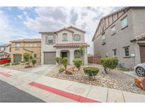 Charming two-story home with landscaped front yard and attached garage at 1135 Paradise Mountain Trl, Henderson, NV 89002