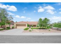 Charming single-story home boasts a terra cotta roof, desert landscaping, and an attached two-car garage at 2825 Brianwood Ct, Las Vegas, NV 89134