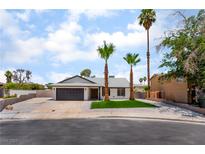 Charming single-story home with well-manicured landscaping and mature palm trees at 3086 Cardinal Dr, Las Vegas, NV 89121