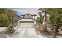 Charming two-story home featuring a two-car garage and landscaped front yard, creating a welcoming curb appeal at 3128 Spring City Ave, North Las Vegas, NV 89081