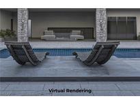 Inviting pool area with lounge chairs and convenient outdoor showers at 4888 Miller Ln, Las Vegas, NV 89149