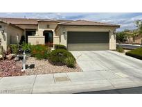 Inviting single-story home featuring a well-manicured yard and an attached two-car garage at 5147 Progresso St, Las Vegas, NV 89135
