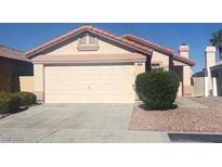 Charming single-story home with a two-car garage, xeriscape, and well-maintained landscaping at 5824 Red Gull St, Las Vegas, NV 89149