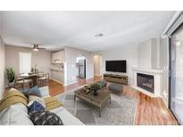 Bright living room featuring fireplace, wood floors, and neutral color scheme, perfect for relaxing and entertaining at 601 Cabrillo Cir # 536, Henderson, NV 89015