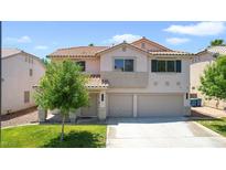 Two-story home featuring a three-car garage, tile roof, and lush lawn, perfect for Gathering living at 1371 Cumulus Ct, Henderson, NV 89014
