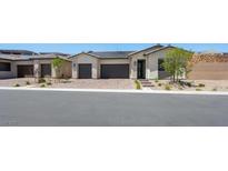 Charming single-story home featuring a three-car garage and desert landscaping at 364 Tigullio Ave, Henderson, NV 89011