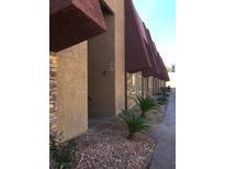 Attractive apartment building with stone accents, desert landscaping and covered walkways at 4421 Alexis Dr # 436, Las Vegas, NV 89103