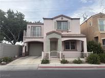Charming two-story home featuring a balcony, covered porch, and attached garage at 508 Candy Mint Ave, Las Vegas, NV 89183