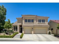 Beautiful two-story home with a well-manicured front yard and a two-car garage at 8928 Stafford Springs Dr, Las Vegas, NV 89134