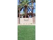 The Falls community entrance welcomes residents with lush landscaping and elegant signage at 9050 W Warm Springs Rd # 1092, Las Vegas, NV 89148