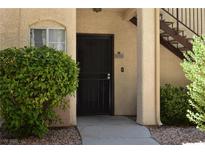 Inviting front door with decorative security screen and well-maintained landscaping at 1830 N Buffalo Dr # 1010, Las Vegas, NV 89128
