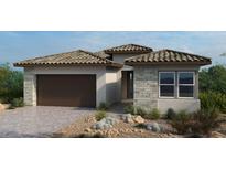 Stylish single-story home featuring a tile roof, stone accents, desert landscaping, and a two-car garage at 214 Piazzetta Pl, Henderson, NV 89011