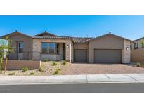 Charming single-story home featuring a three-car garage and stone accents at 241 Paraggi Bay Dr, Henderson, NV 89011