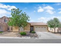 Charming single-story home featuring a neutral color scheme, well-maintained landscaping, and a two-car garage at 3752 Calle De Rio Ave, Las Vegas, NV 89115