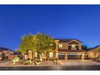 Charming two-story home featuring a three-car garage and well-manicured landscaping at 4737 Barcelona Ridge Ct, Las Vegas, NV 89129