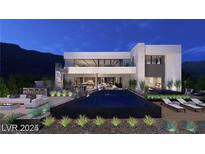 Stunning modern home showcasing a sleek pool, and outdoor lounge areas in a beautifully landscaped backyard at 611 Grand Rim Dr, Henderson, NV 89012