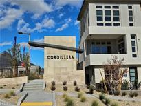 The Cordillera community entrance features modern architecture, desert landscaping, and clean concrete walkways at 646 Spotted Falcon St, Las Vegas, NV 89138
