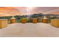Spacious balcony overlooking the lake with scenic views of the mountains during a celebratory fireworks display at 29 Montelago Blvd # 131, Henderson, NV 89011