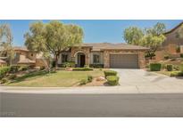 Charming single-story home features well-manicured lawn and two-car garage at 40 Stonemark Dr, Henderson, NV 89052
