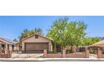 Charming single-story home with a well-maintained front yard and gated entry at 5453 Palisades Quad Ave, Las Vegas, NV 89122