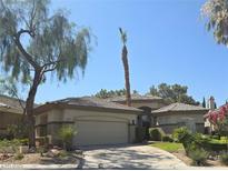 Charming single-story home with desert landscaping and a well-manicured front yard at 601 Summer Mesa Dr, Las Vegas, NV 89144