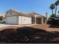 Charming single-story home with well-maintained landscaping and a classic desert aesthetic in a residential neighborhood at 7542 Mycroft Ct, Las Vegas, NV 89147