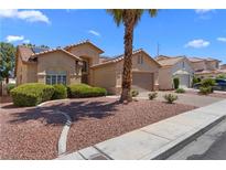 Charming single-story home featuring a well-maintained yard and desert landscaping at 1132 Coral Desert Dr, Las Vegas, NV 89123