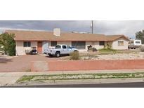 Single story home featuring neutral tones and a well-maintained front yard at 217 Kola St, Henderson, NV 89015