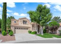 Charming two-story home featuring a well-manicured lawn, and a spacious three car garage at 2417 Chestnut Hill St, Las Vegas, NV 89134