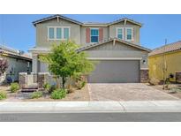 Charming two-story home featuring a manicured front yard and a spacious two-car garage at 2940 Duverney Ave, Henderson, NV 89044