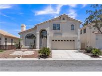 Charming two-story home with a two-car garage and landscaped front yard at 3544 Mountain Valley Dr, Las Vegas, NV 89129