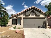 Charming single-story home with a well-maintained front yard and a two-car garage at 4021 Broadriver Dr, Las Vegas, NV 89108