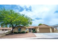 Charming single-story home featuring mature landscaping and a two-car garage at 4161 Royalhill Ave, Las Vegas, NV 89121