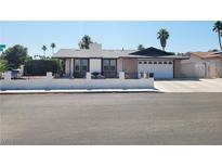 Charming single-story home with a well-maintained front yard and attached two car garage at 5397 Lamoille Cir, Las Vegas, NV 89120