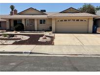 Charming single-story home with a well-maintained front yard and two-car garage at 6241 Pinewood Ave, Las Vegas, NV 89103