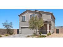 Charming two-story home features a well-manicured lawn and a neutral color scheme at 9054 Tangerine Tree Ct, Las Vegas, NV 89113