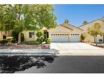 Charming single-story home with a well-manicured lawn and a two-car garage at 1311 Rolling Sunset St, Henderson, NV 89052