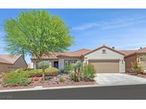 Charming single-story home featuring a well-manicured lawn, desert landscaping, and a two-car garage at 2292 Saxtons River Rd, Henderson, NV 89044