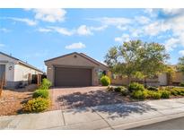 Charming single-story home with a two-car garage and a beautifully landscaped front yard at 3782 Neblina Dr, Henderson, NV 89052