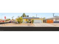 Charming single-story home with solar panels, xeriscaped yard, and a two-car garage at 4201 Sunrise Ave, Las Vegas, NV 89110