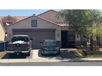 Charming single-story home featuring a well-maintained lawn and a two-car garage, located in a quiet neighborhood at 422 Rancho Del Norte Dr, North Las Vegas, NV 89031