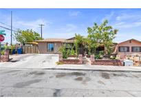 Charming single-story home featuring a well-maintained front yard and a welcoming facade at 4606 Powell Ave, Las Vegas, NV 89121