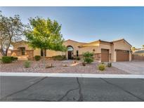 Charming single-story home boasts desert landscaping and attached two-car garage at 7670 Frittata Ave, Las Vegas, NV 89113