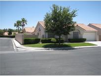 Charming single-story home featuring a well-manicured front yard and attached two-car garage at 7955 Canto Ave, Las Vegas, NV 89147